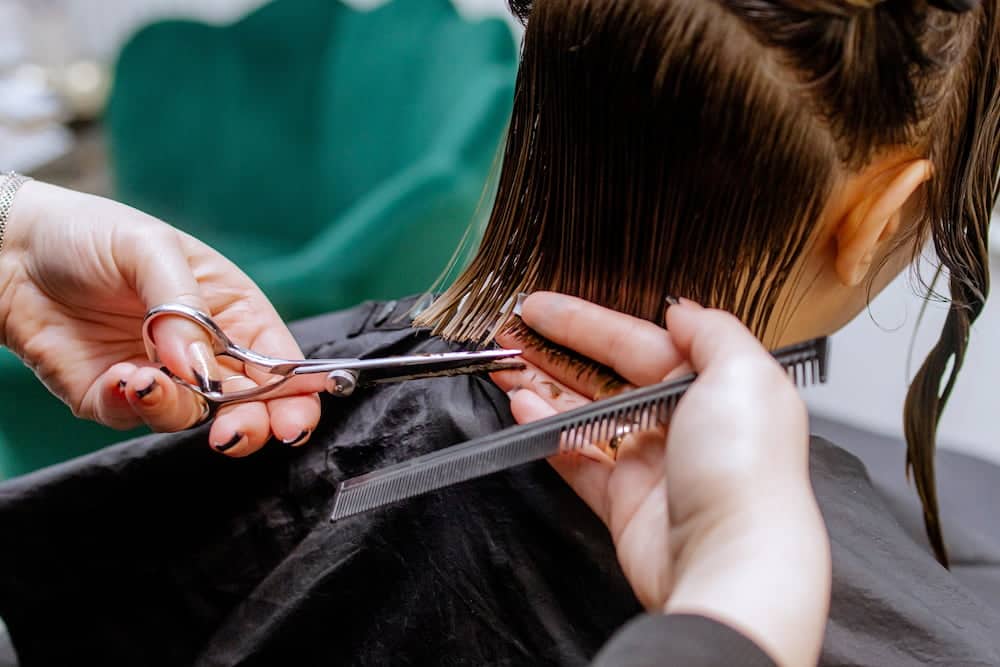 A woman getting a regular haircut